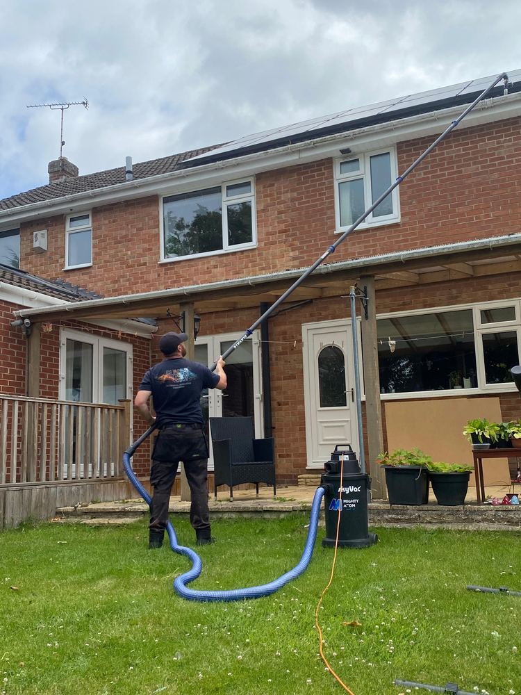 Gutter clearing from the rear garden of a semi-detached house.