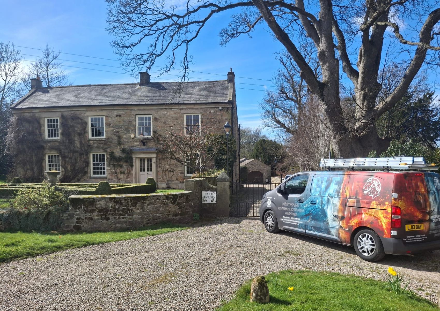 The Clear As Day van parked outside a 17th-century Grade II listed property during a window clean.