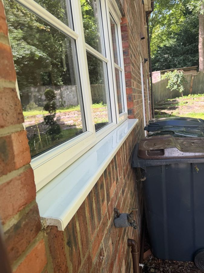 A cleaned bay window with the frame and sill wiped down as part of the visit.